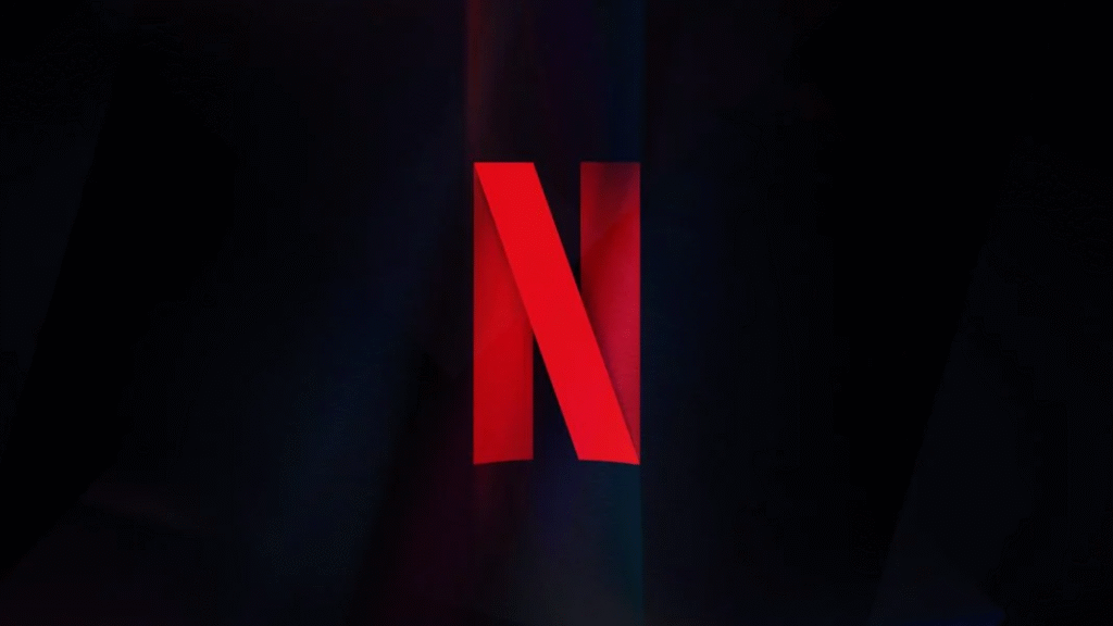 Logo vermelho da Netflix sobre fundo escuro, usado para ilustrar notícia sobre a compra da Warner Bros. Discovery.