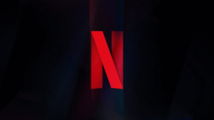 Logo vermelho da Netflix sobre fundo escuro, usado para ilustrar notícia sobre a compra da Warner Bros. Discovery.