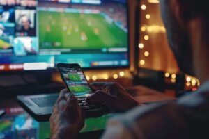 Pessoa utilizando aplicativo de apostas esportivas; alertas de risco para apostas online passam a ser obrigatórios no Brasil.